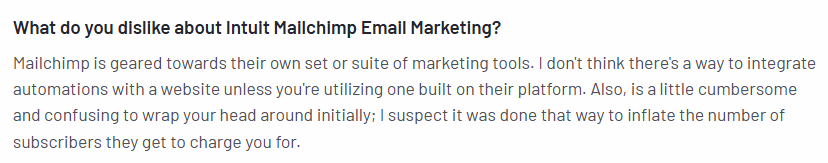 User review highlighting Mailchimp's list management complexity and billing issues with inactive contacts